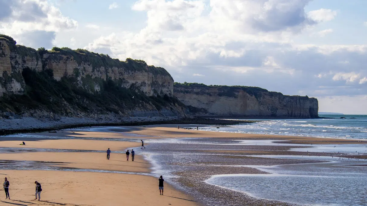 Low tide on a Normandy beach below the coastal bluffs
