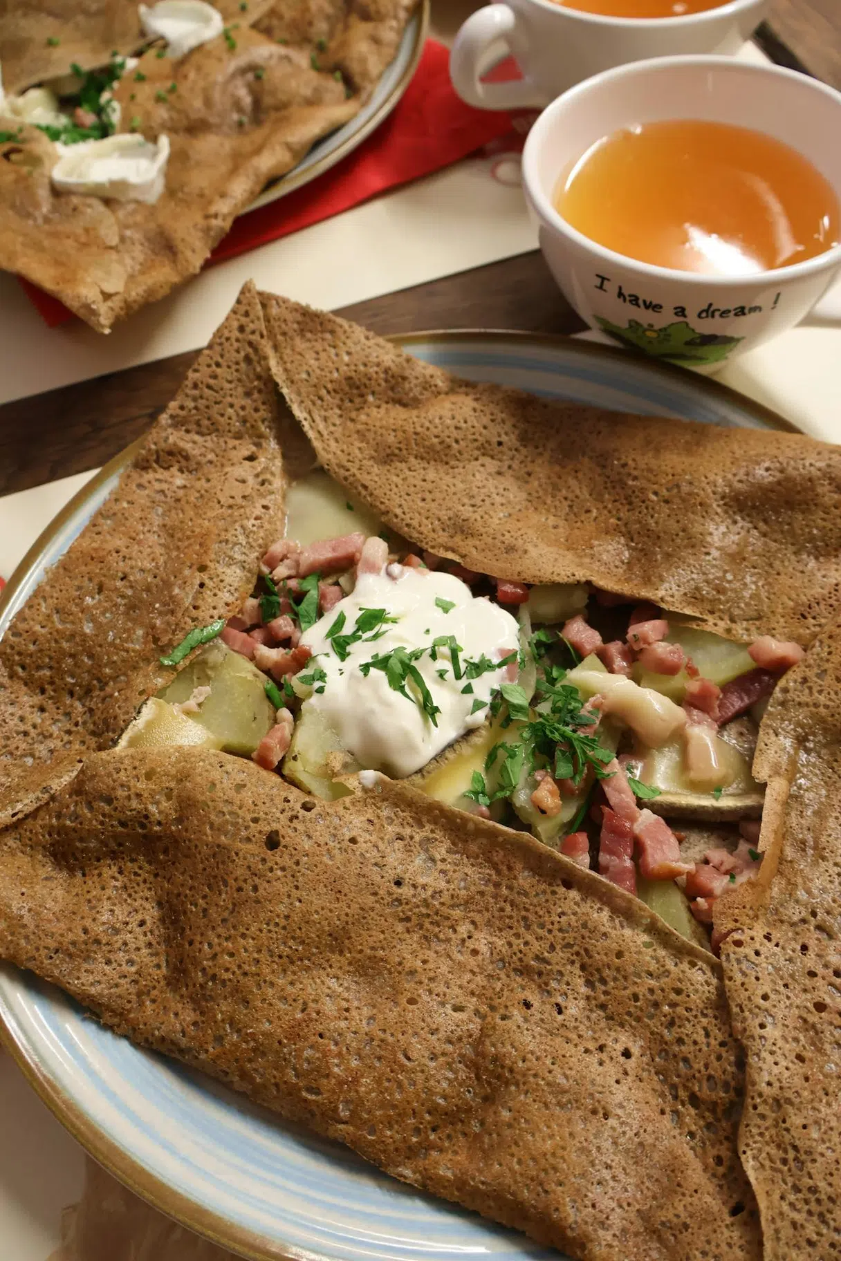 Breton buckwheat galette: specialty from Brittany (e.g., the complète with egg, ham, cheese)