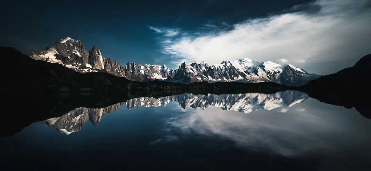 Mont Blanc reflected in an Alpine lake under a clear summer sky