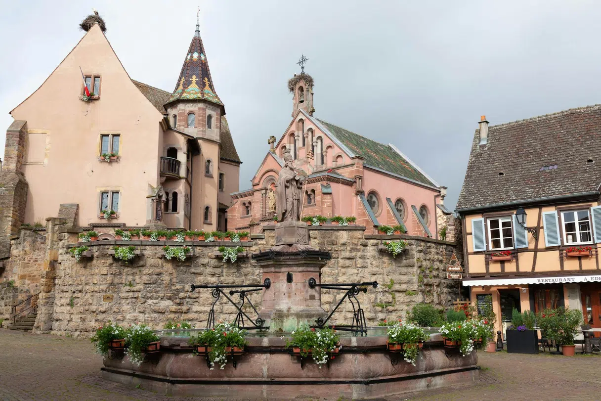 A flowered square with a fountain in Eguisheim