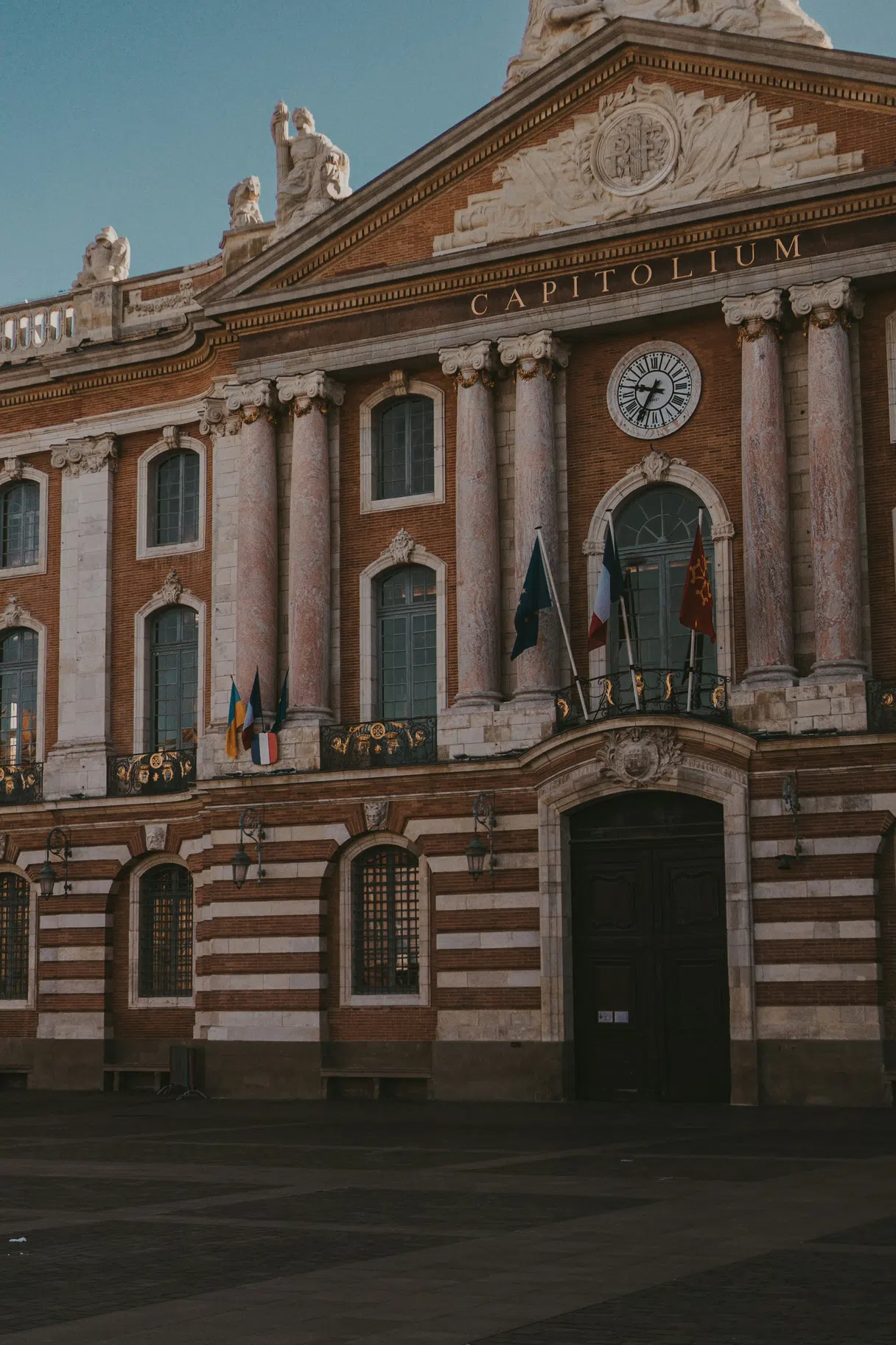 The red-brick Capitole building in Toulouse seen from the square