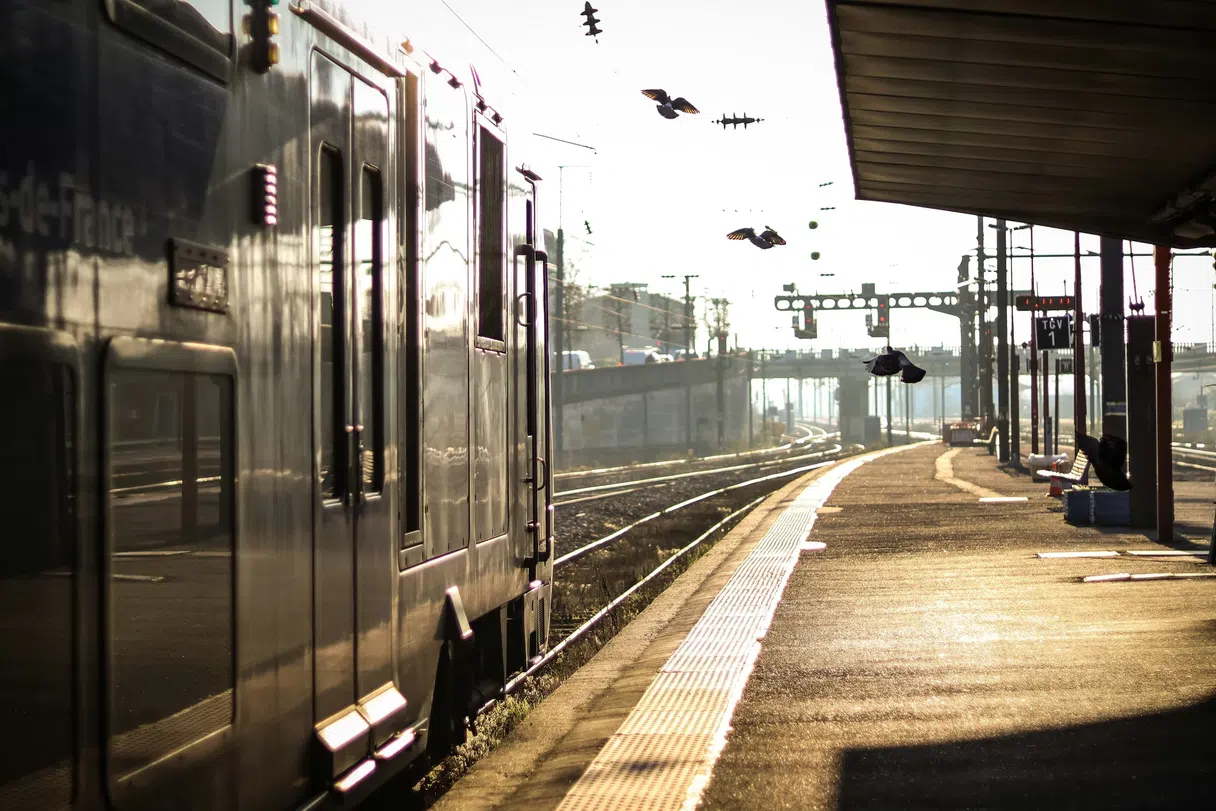 Train platform in France at golden hour, train ready to depart