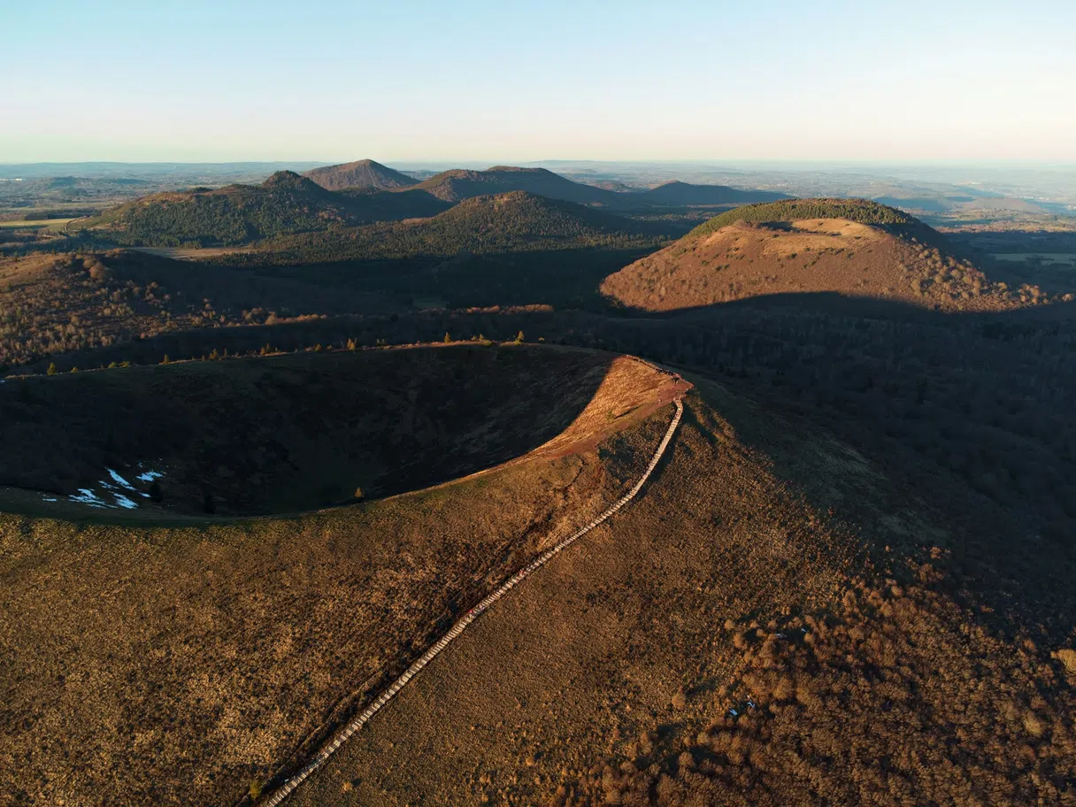 Rounded green volcanic peaks in Auvergne